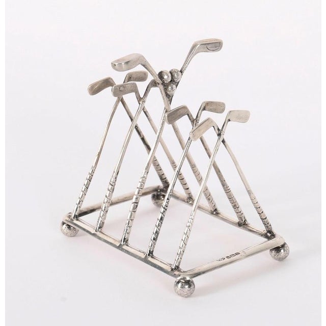 This is a delightful antique sterling silver toast/letter rack bearing hallmarks for Birmingham with the date mark for...