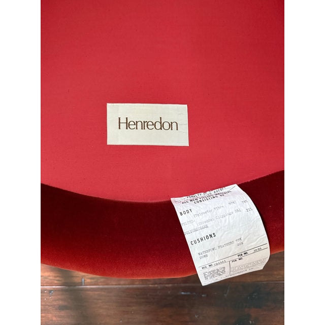 An elegant French Provincial style armchair crafted by Henredon. Featuring a gracefully contoured backrest, carved wooden...