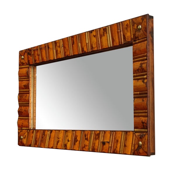 Rectangular wall mirror with a bamboo and rattan frame, typical of the Italian bohemian style of the 1960s. The bamboo and...
