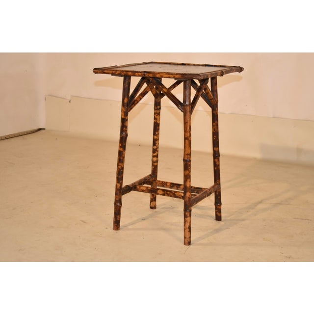 19th century tortoise bamboo table fro France with hand painted chinoiserie top. The top is hand decorated and is...