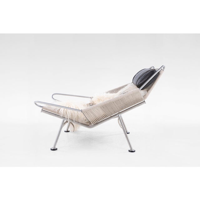 A rare Flag Halyard Chair by Hans J. Wegner, produced by PP Møbler in 2002. Originally designed in 1950, this sculptural...