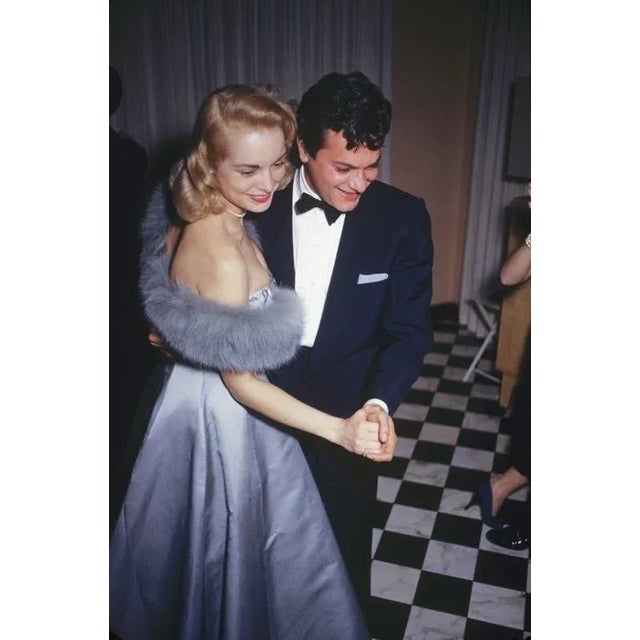 Let’s Dance 1954 Film stars Tony Curtis and his wife Janet Leigh enjoying a dance at a party held at James Mason’s home in...