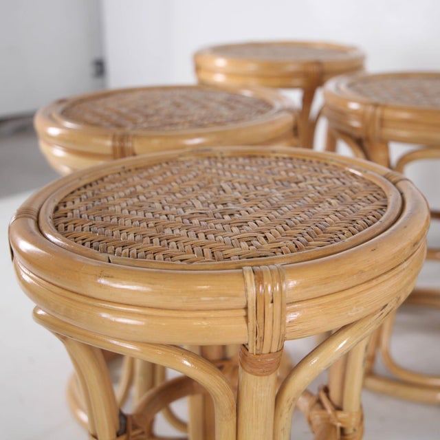 Superb set of 6 vintage rattan stools with woven seats. It's rare to find such a set in such remarkable condition.