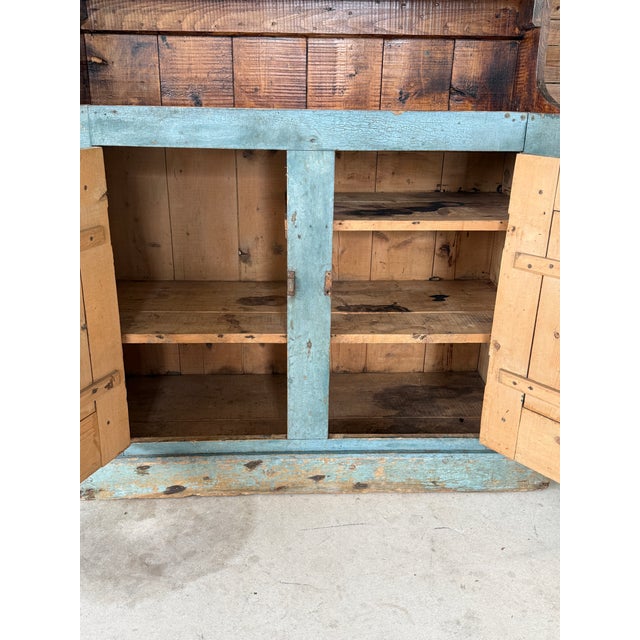 An exceptionally early and massive primitive cupboard / dry sink with breathtaking age, presence, and soul. This is the...