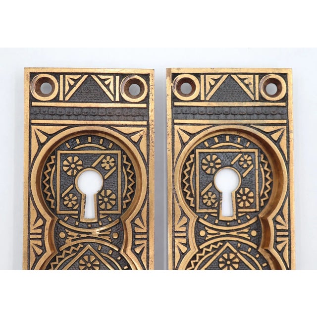 Aesthetic style recessed pocket door plates made of brass with a polished brass and black finish. The original mounting...