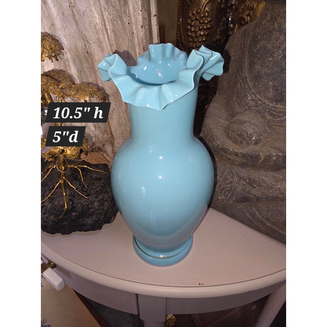 Pretty antique glass vase with a ruffle neck and a single gold accent rim detail around the base area.