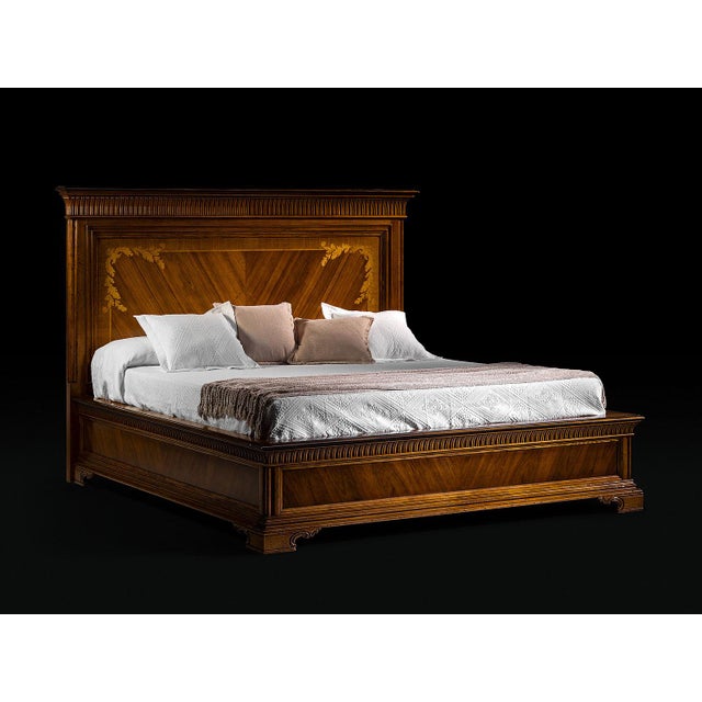 Handcrafted in Italy from solid walnut, this Empire style bed features a paneled headboard with decorative wood marquetry...