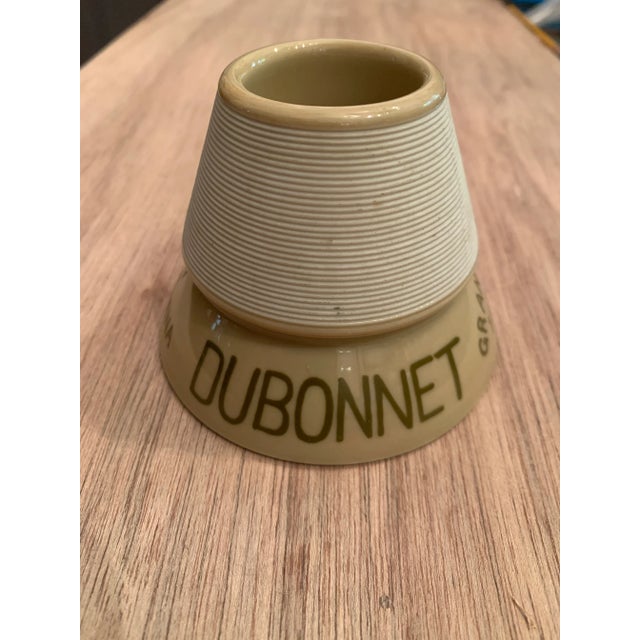 1950s French porcelain pyramid shaped match striker with ribbed top and glazed hand painted printed lower half.