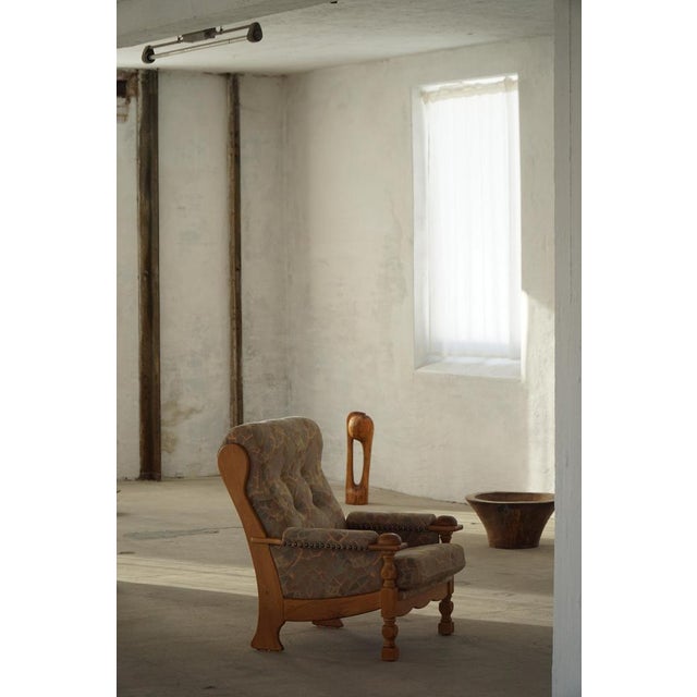 A refined pair of Danish Modern lounge chairs attributed to Henning Kjærnulf, crafted in Denmark during the 1960s. The...