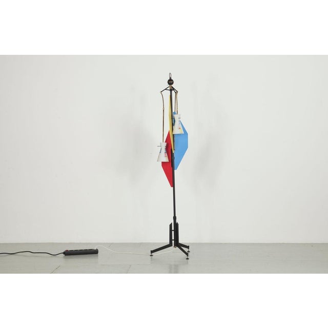 Italian floor lamp from the 50s. The lamp has three small lampshades made of satin glass. The glass was hand-painted with...