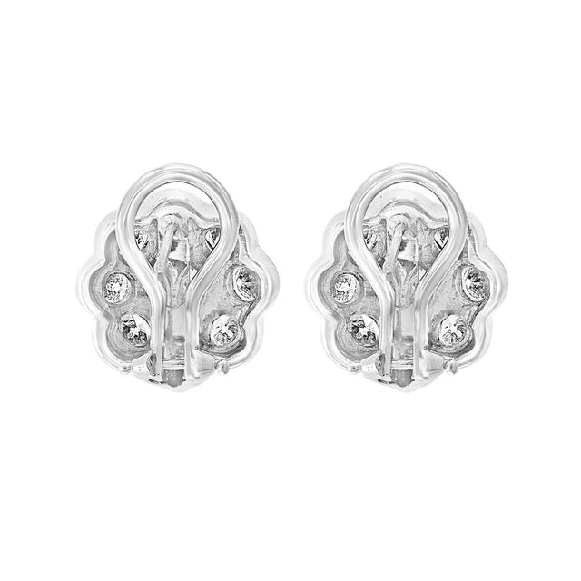 A fabulous pair of earrings with an enormous amount of look and sparkle! 3.6 carats of F-G color VS clarity diamonds set...