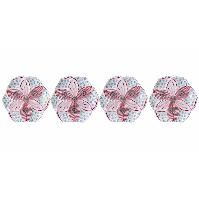 This exceptional set of four artisanal ceramic plates beautifully captures a vibrant, contemporary take on regional craft,...