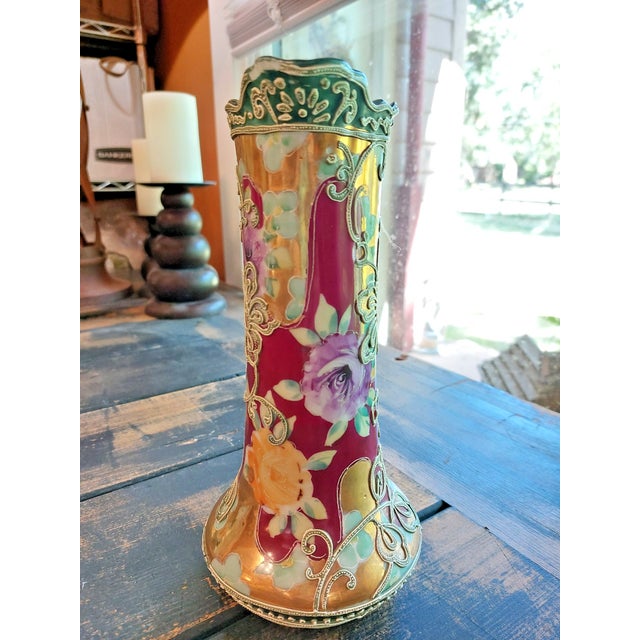 This antique Royal Nippon pitcher vase features hand-painted floral designs, gold background and raised gold and white...