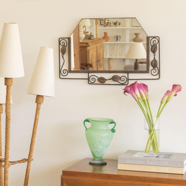 Beautiful Art Nouveau iron mirror from France, 1920s. Iron frame and hexagonal mirror with leaf detail. All original with...