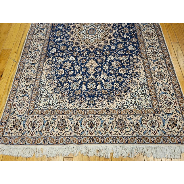 A beautiful Persian Nain room-size rug in a very rare French blue color and cream colors with silk highlights from the 3rd...