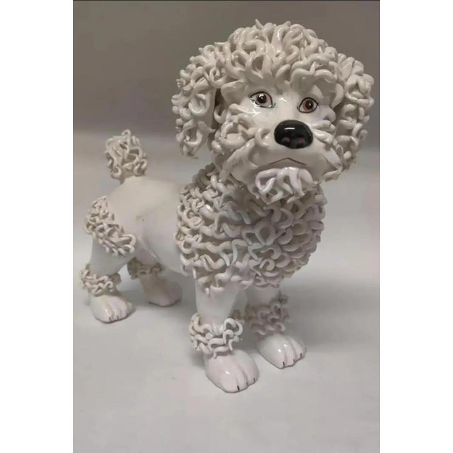 This fabulous little porcelain poodle dog figurine/sculpture is full of character. It was made in Italy in the 1950's. The...
