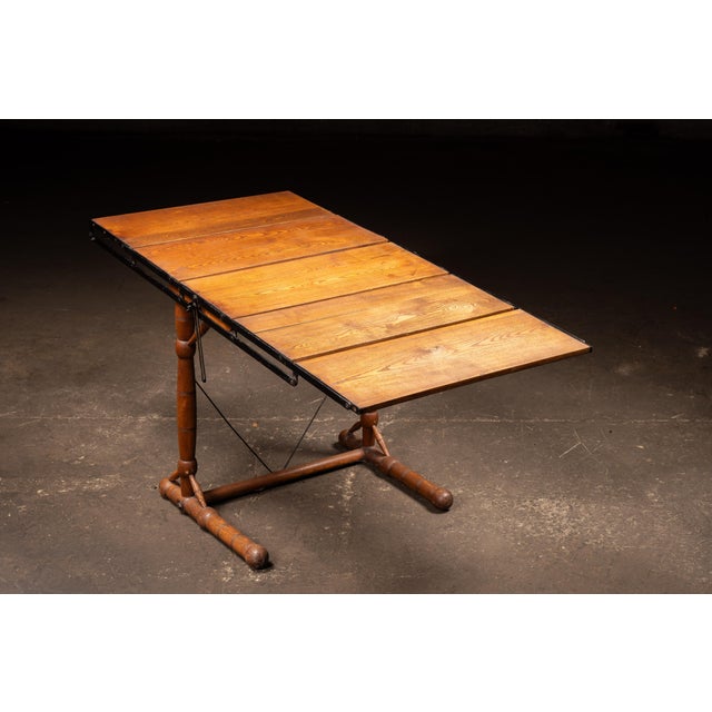 Ingenious convertible baker's rack combining wood and iron into a dual-purpose form that shifts from upright shelving to a...