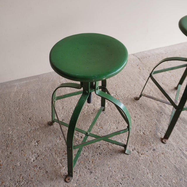 Green Industrial Stools (Pair). 32cm diameter seat x 40cm squared bottom x 63cm - 77cm high