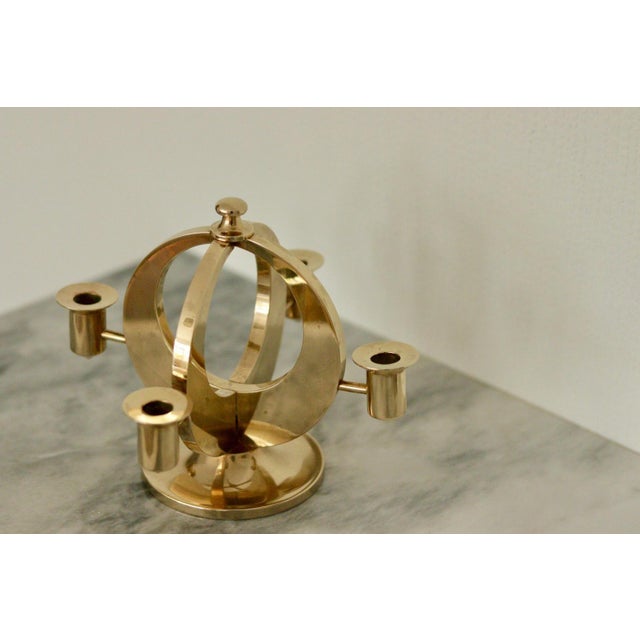 A beautifully crafted Swedish brass Candelabra, designed for narrow candles. Elegantly signed at the base by Arthur Pe,...