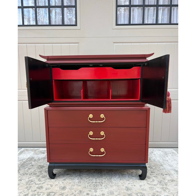 Gorgeous rich shade of red looks amazing with the gold hardware on this exceptional Kent Coffey chinoiserie chest. Open...