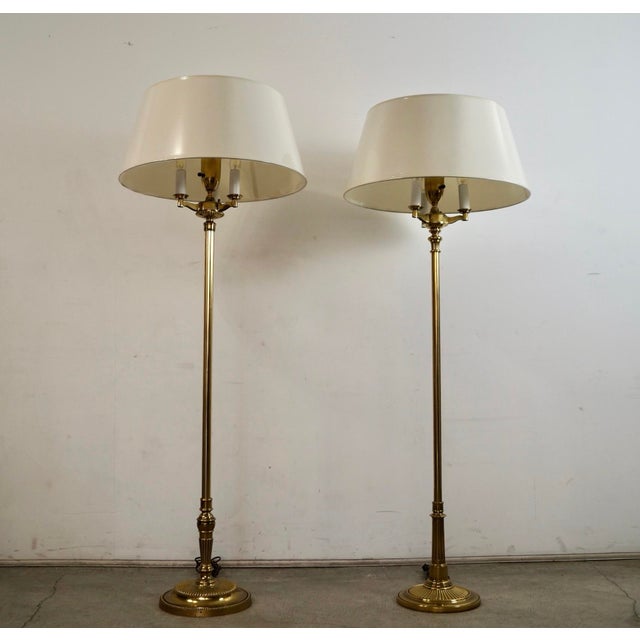 Pair of 1970's Hollywood Regency torchiere floor lamp for sale. They were manufactured by Stiffel, and are high-end brass...