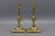 Elegant pair of French Neoclassical Revival bronze candlesticks from the 1930s, featuring urn-shaped stems and finely...