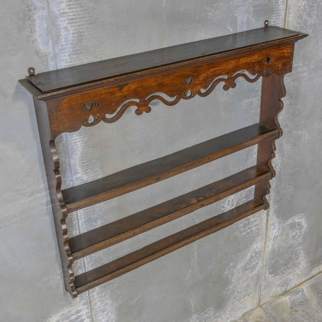 This is a beautiful example of an 18th Century wall/plate rack. Oak in construction and with three graduated shelves...