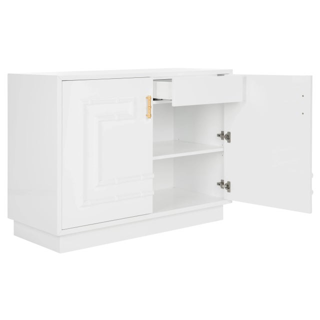 The Lacquer Bamboo Cabinet is beloved by the modern host. it's white lacquer finish, gold leaf hardware and bamboo detail...