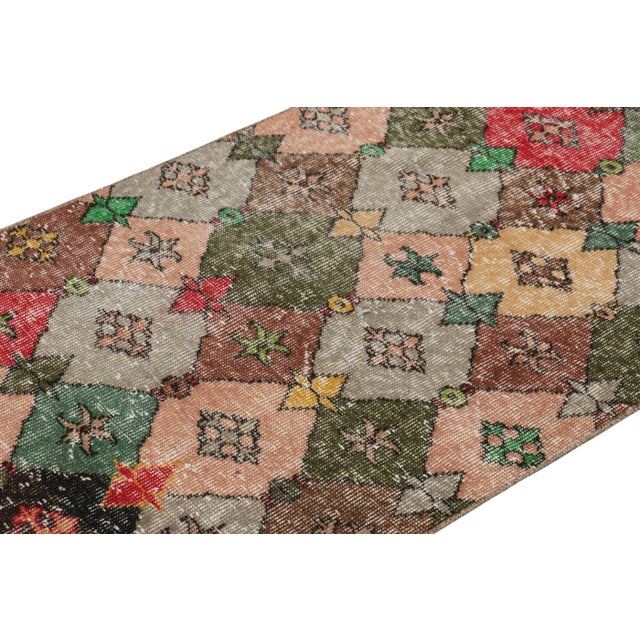 Hand-knotted in wool and originating from Turkey circa 1960 – 1970, this 3x7 vintage Zeki Müren runner rug is a unique...