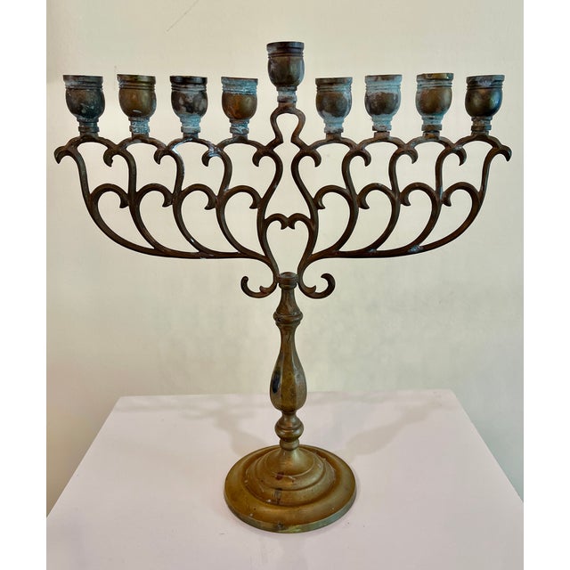 Vintage brass menorah in a simple, elegant Eastern European style. An estate sale find - the owner was born in Germany....