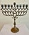 Vintage brass menorah in a simple, elegant Eastern European style. An estate sale find - the owner was born in Germany....