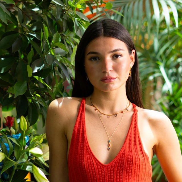 Add a vibrant touch of elegance to your style with the Multicolor Gemstone Gold Chain Choker Necklace. This gold-toned...