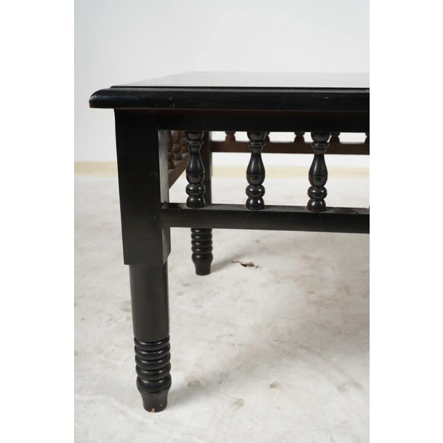 20th century ebony coffee table with turned wood details. Provenance: Property from The Netter Estate, Beverly Hills,...