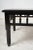 20th century ebony coffee table with turned wood details. Provenance: Property from The Netter Estate, Beverly Hills,...