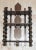 This early twentieth century folk / tramp art wall hanging shelf is made from wood thread spools and wooden scraps. This...