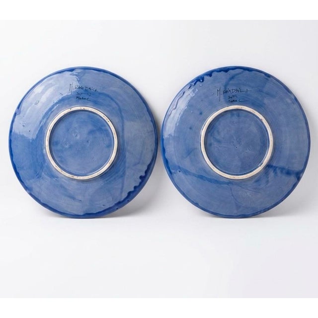 Distinguished by an uncommon and sophisticated color story, these pieces feature a dreamy periwinkle-lavender ground glaze...