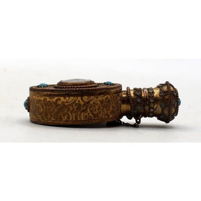 Circa 1900 gilt brass filigree & enamel scent bottle, European. The central portrait hand-painted of an elegant woman....