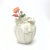 This gorgeous 1980s white vase is a plaster matte piece, featuring a ruffled detail with a rope and tassel closure....