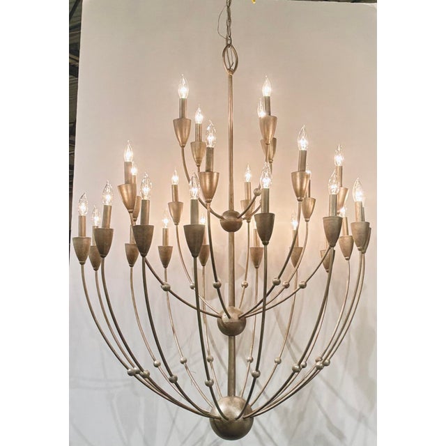 Original retail $4990, stylish Currey & Company Modern Large Silver Paradox Chandelier, showroom floor sample