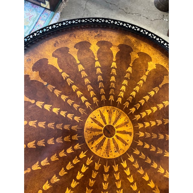 Incredible round three leg side table attributed to Theodore Alexander. Round top with pierced bronze gallery and heavily...