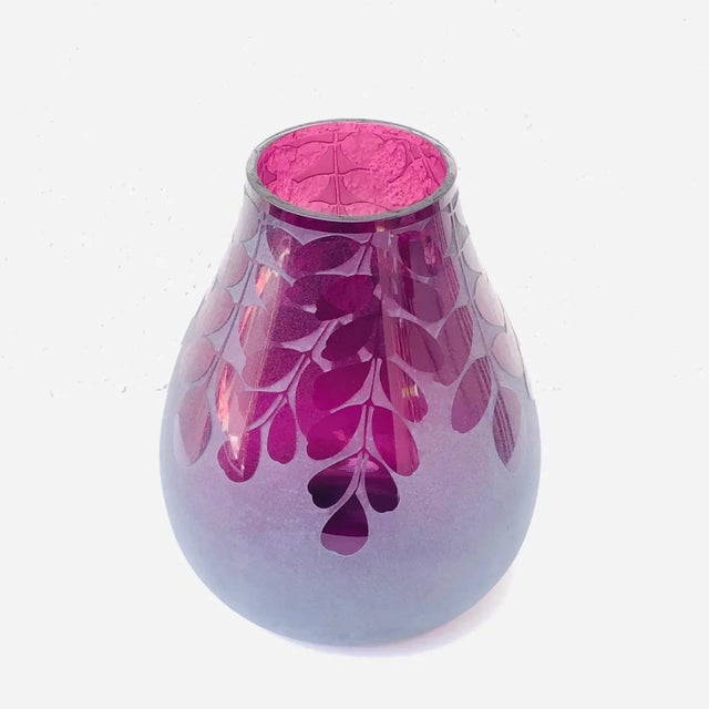 This is a beautiful hand crafted art glass vase by Ken Benson. It is signed underneath: "Ken Benson LS". "LS" ("Life...