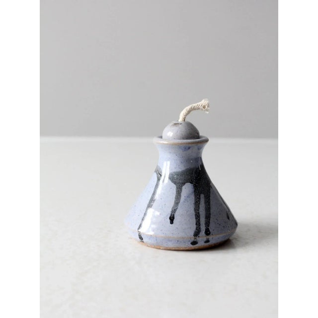 This is a vintage studio pottery oil lamp candle dated 1984. Signed by the artist, the handmade oil candle features a...
