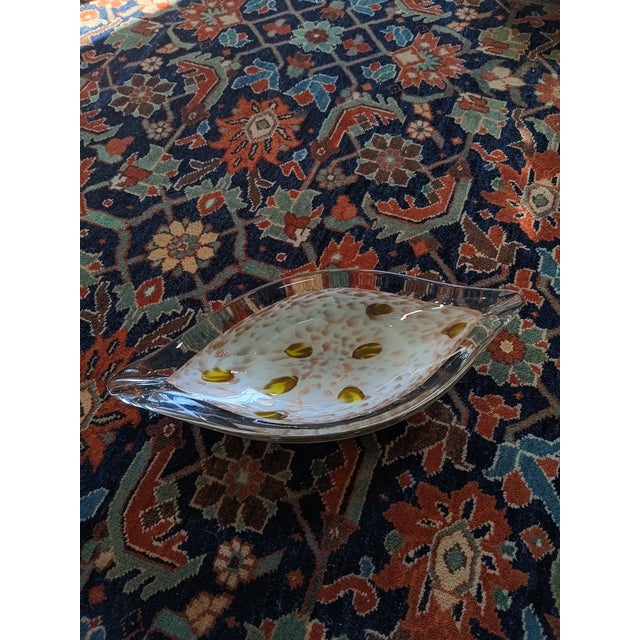 This exceptional mid-century art glass bowl, attributed to the master glassmakers of Murano, Italy, is hand-blown in a...