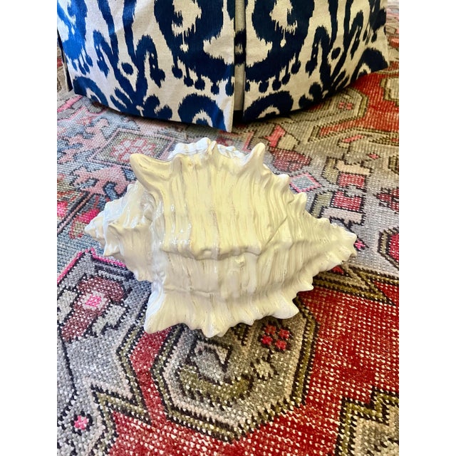 This gorgeous large conch shell is ceramic with a removable lid. In the laundry room, this could be used to store pods or...