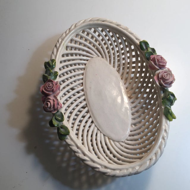 Handmade and marked Italy on the bottom. Ivory color with delicate pale pink flower decorations. Petite and charming.