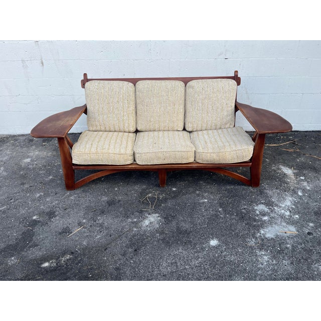 A rare and well-preserved transitional modern American Craftsman style sofa designed by Dutch born craftsman Herman De...
