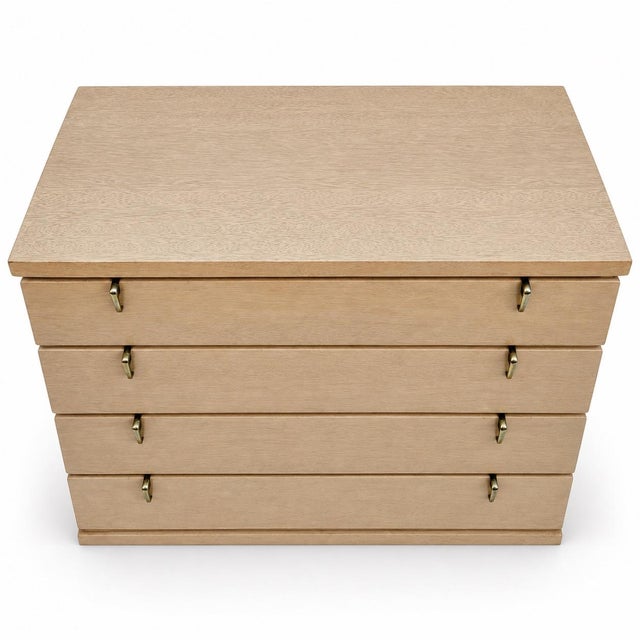 This is a pair of mid-century modern blonde mahogany chest attributed to Joseph Carper. Joseph Carper was a prominent mid-...