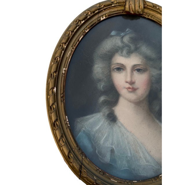 An elegant 19th-century original pastel portrait under glass, depicting a young woman with softly powdered hair and a...
