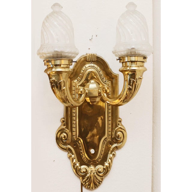 Art Nouveau Wall Lamp Large Art Nouveau wall lamp, circa 1900. Large, embossed brass wall plate with two curved arms....