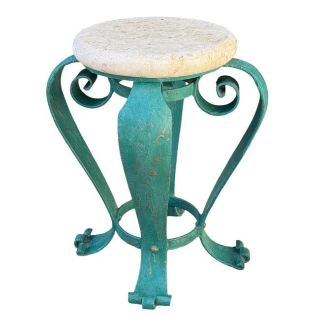 Vintage hand-painted iron side table with a turquoise and teal finish and gold-painted accent details throughout. The...